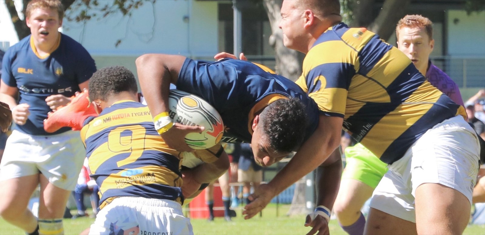 A Rondebosch Boys' player carrying the ball through a tackle