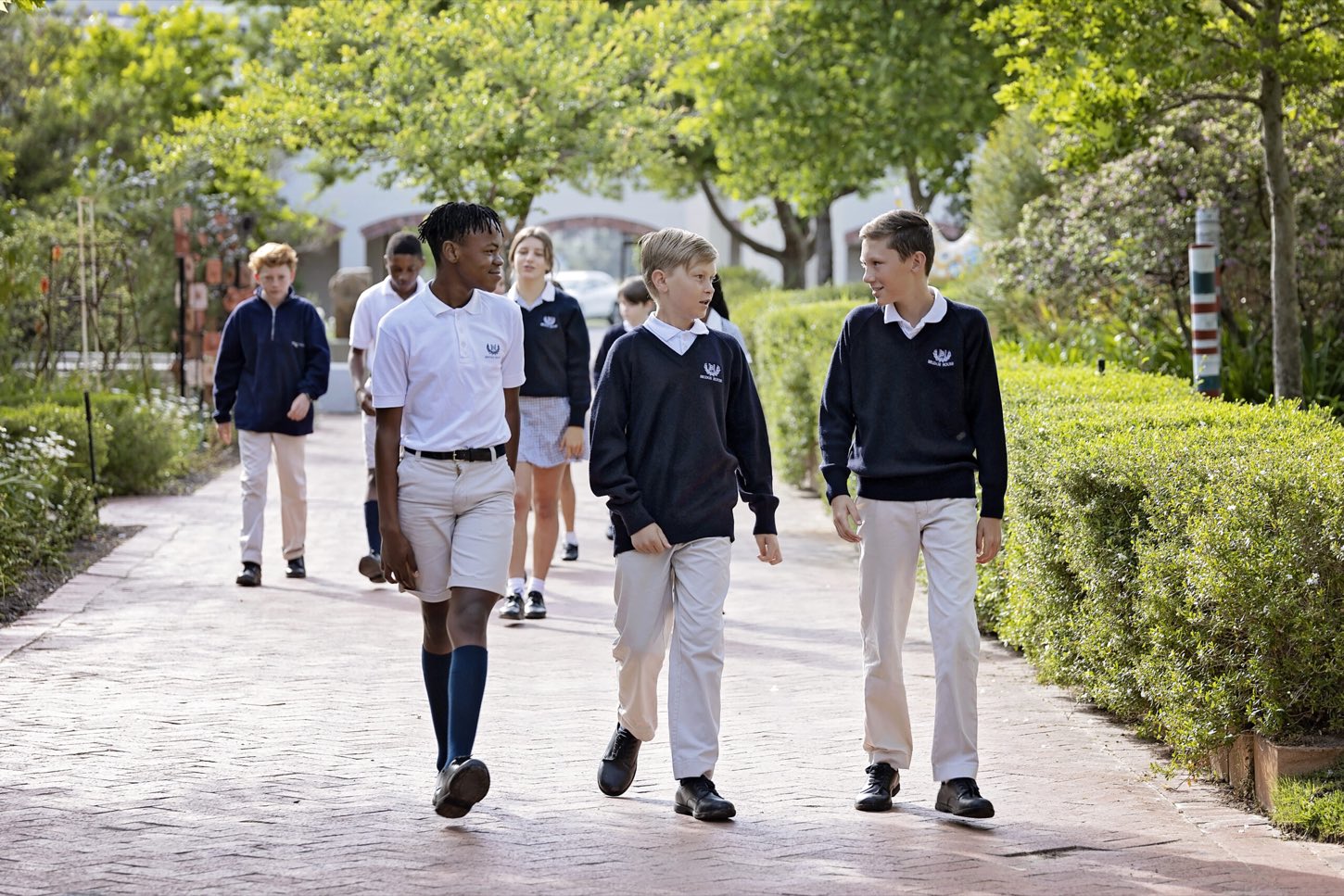 Bridge House students walking through the campus grounds