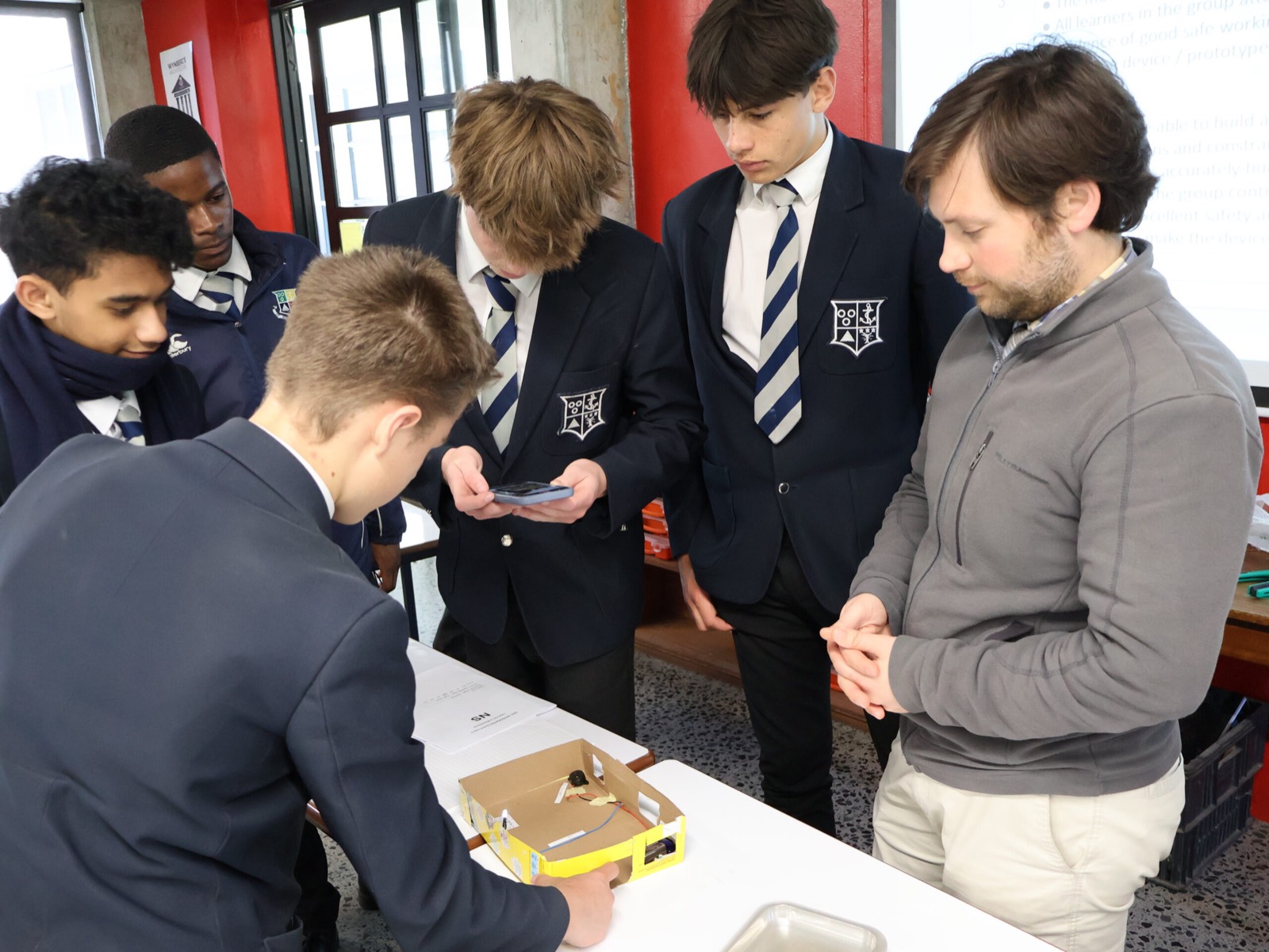 Wynberg Boys' High School pupils in school blazers working together